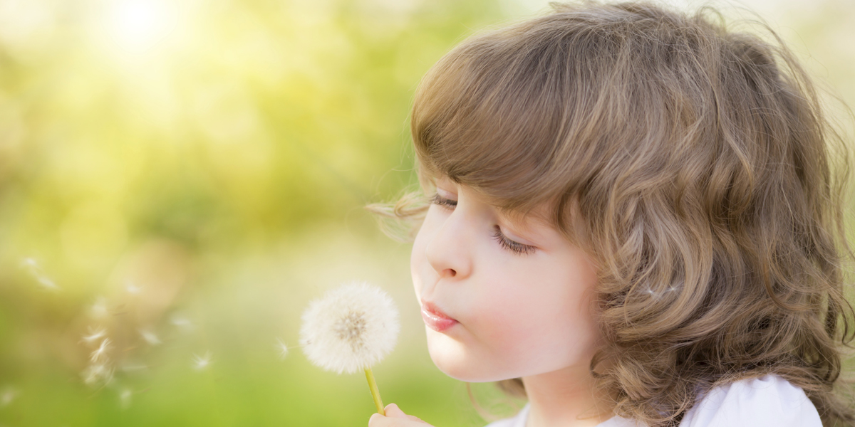 Happy child blowing dandelion_thinkstock_480256981_1200x600.jpg